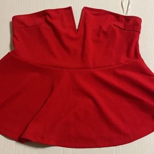 Woman red strap less peplum top from fashion nova. Never worn size large.